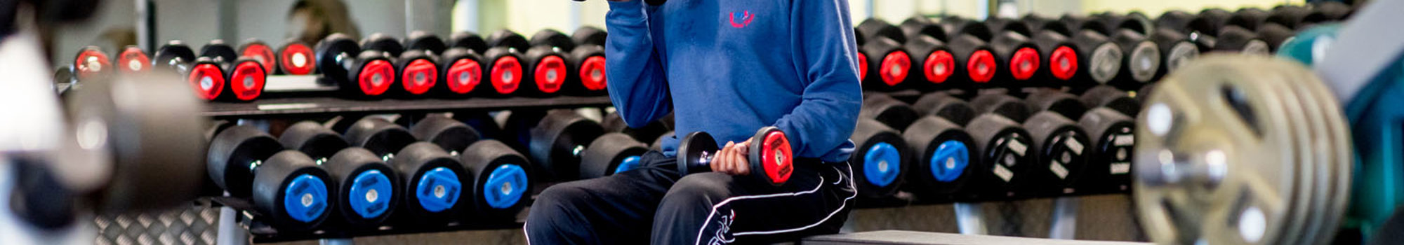 Man Using Hand Weights